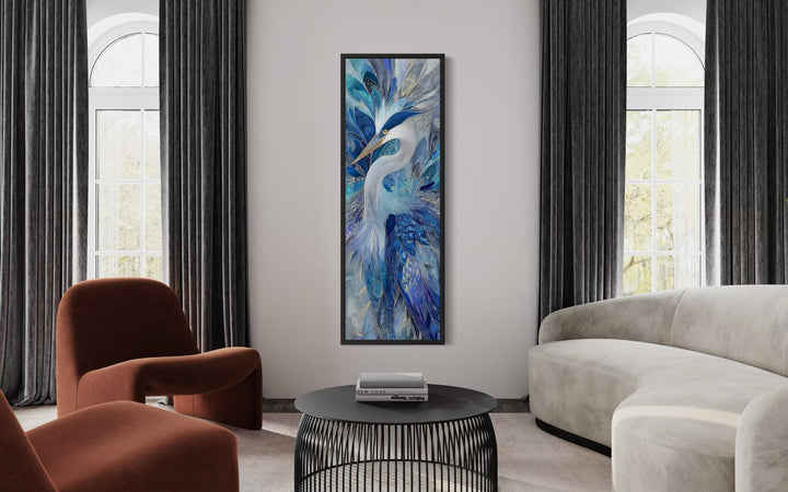Vertical canvas print of an elegant blue heron in a modern living room setting.