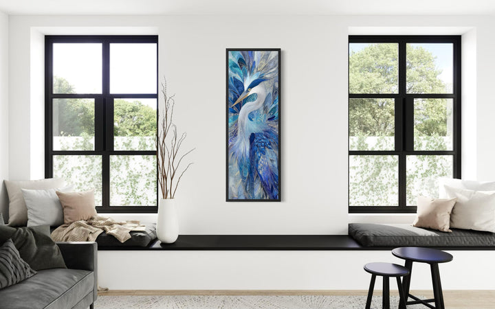 Vertical canvas print of an elegant blue heron with abstract textures in a modern living room.