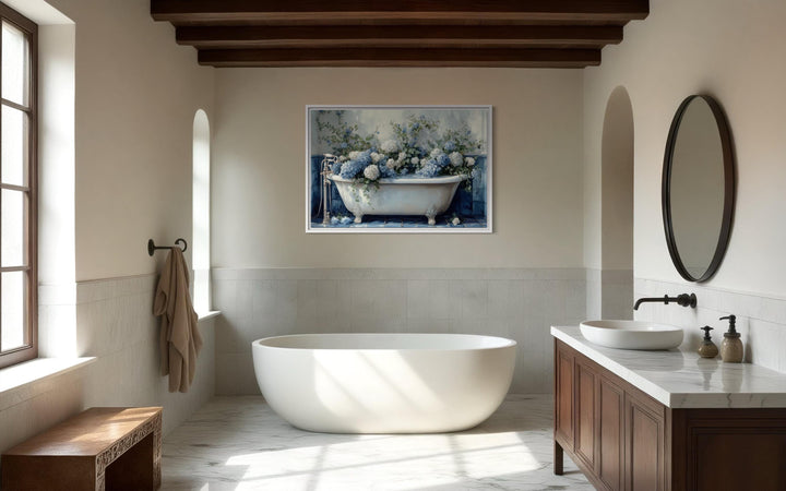 Blue and white hydrangea flowers in a vintage clawfoot tub canvas print on a bathroom wall.