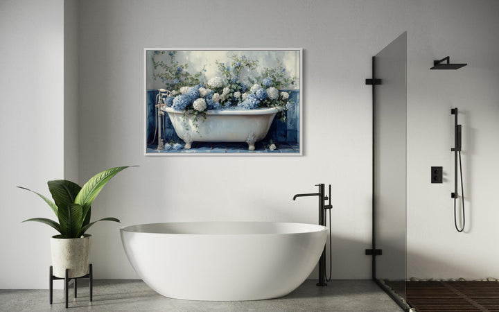 Hydrangea in clawfoot tub canvas print hanging above a modern white bathtub in a bathroom.