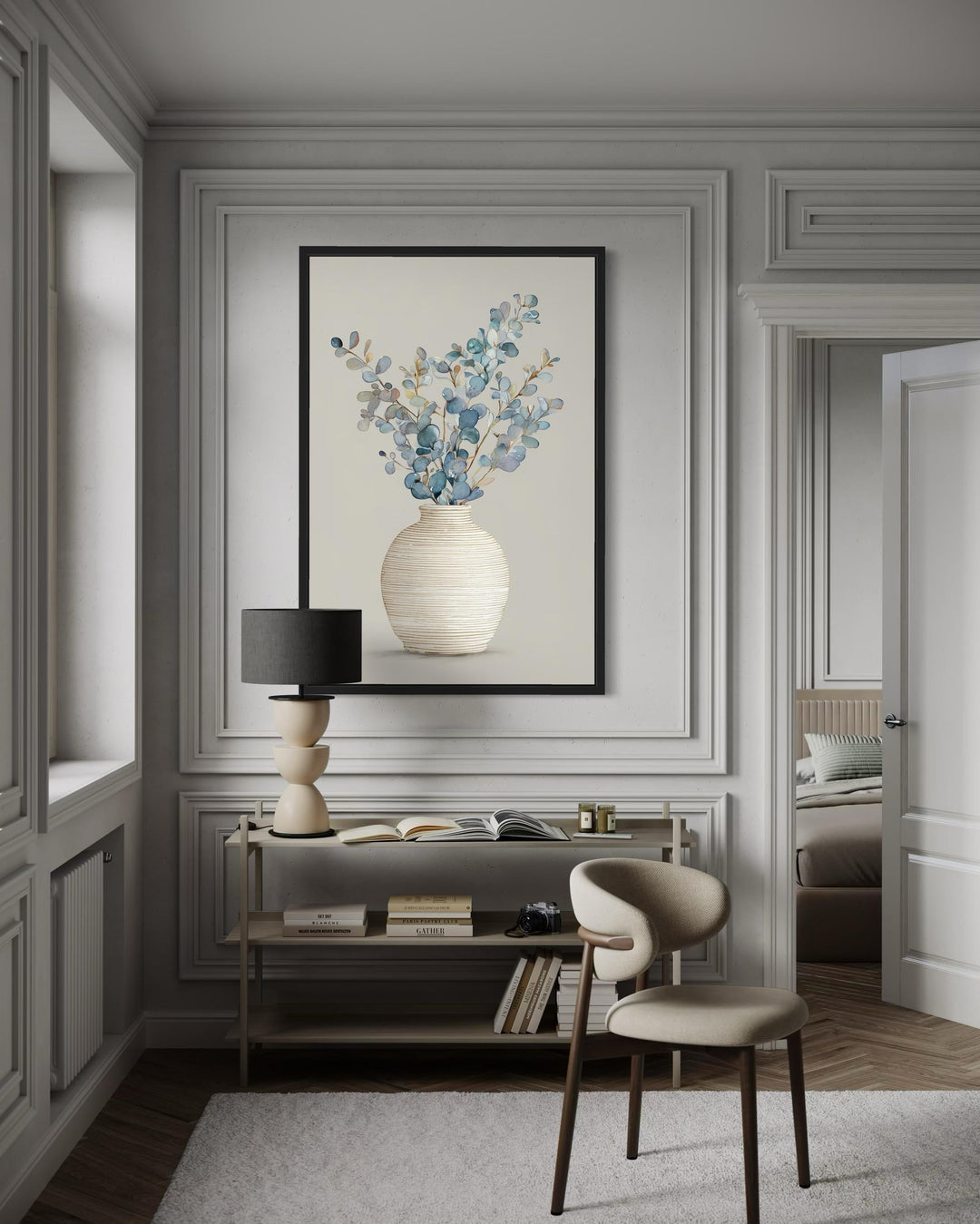 Blue floral still life wall art featuring eucalyptus branches in a textured vase on a cream wall.