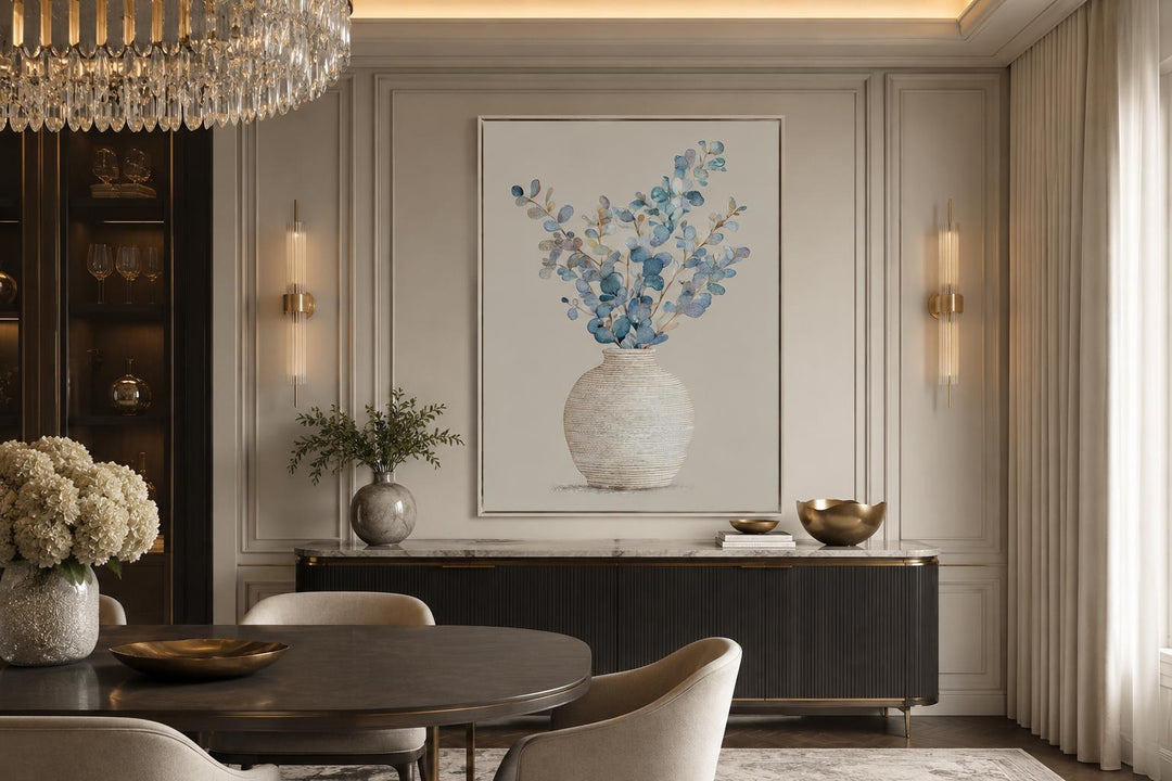 Blue floral still life wall art featuring eucalyptus branches in a textured vase with gold frame.