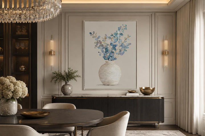 Blue floral still life wall art featuring eucalyptus branches in a textured vase with gold frame.