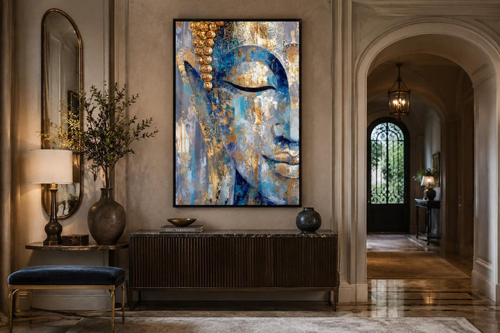 Blue and gold abstract Buddha canvas wall art hanging above a dark wood console table.