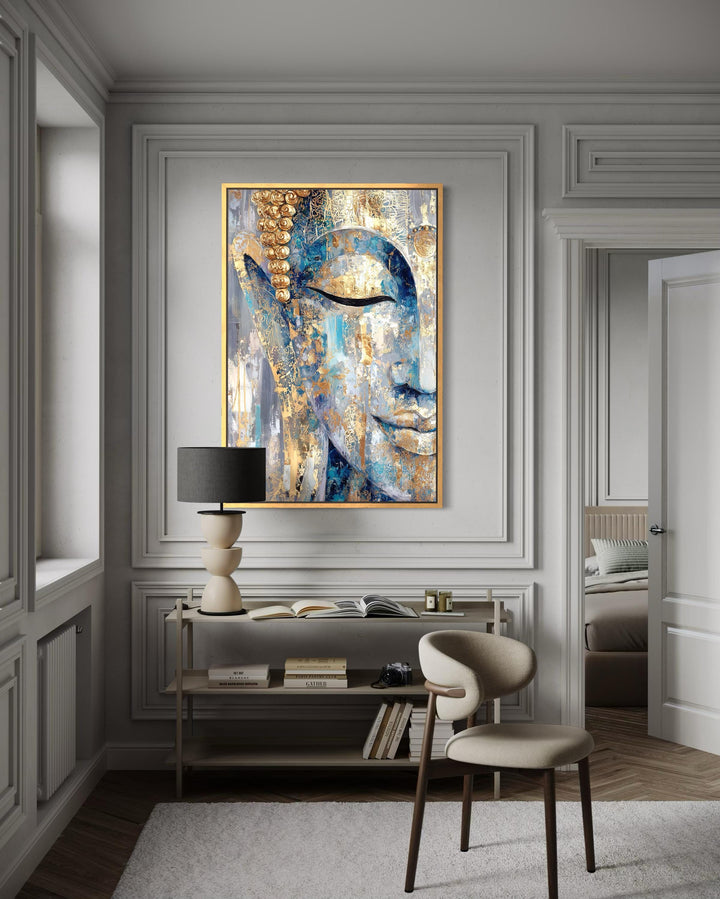 Blue and gold abstract Buddha canvas wall art in a modern living room with a console and chair.