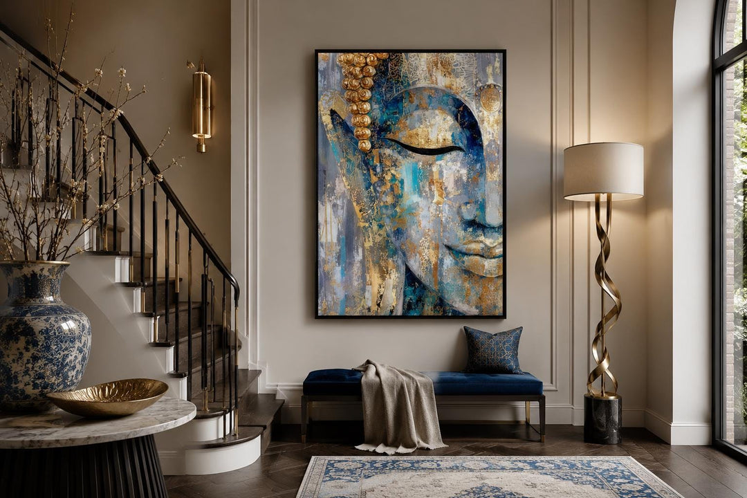 Vertical blue and gold abstract Buddha canvas wall art hanging in a modern living room entryway.