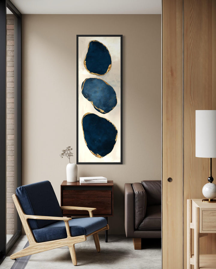 Vertical narrow canvas print featuring three stacked blue abstract stones with gold leaf edges.