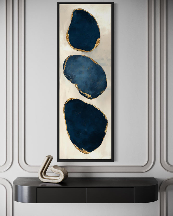 Vertical narrow canvas print featuring three stacked blue abstract stones with gold leaf edges.