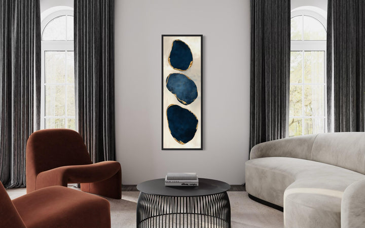 Vertical narrow canvas print featuring three stacked blue abstract stones with gold edges.