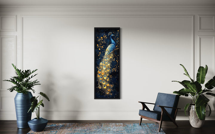Tall narrow vertical framed canvas wall art featuring a blue and gold peacock on a navy background.