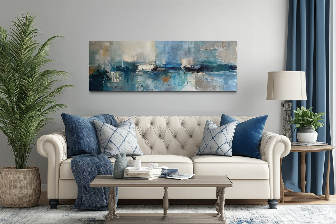 Long narrow abstract wall art in blue, grey, and aqua tones.