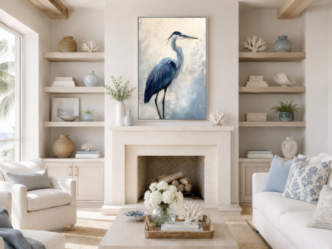 Vertical framed canvas wall art of a blue heron abstract painting above a stone fireplace.