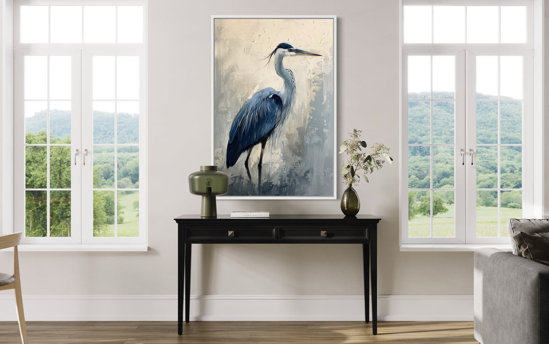 Blue Heron Abstract Painting Coastal Framed Canvas Wall Art hanging above a black console table.
