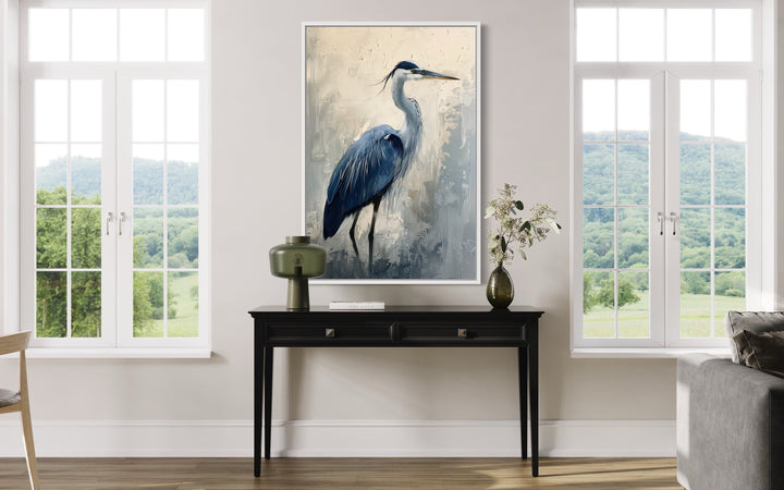 Blue Heron Abstract Painting Coastal Framed Canvas Wall Art hanging above a black console table.