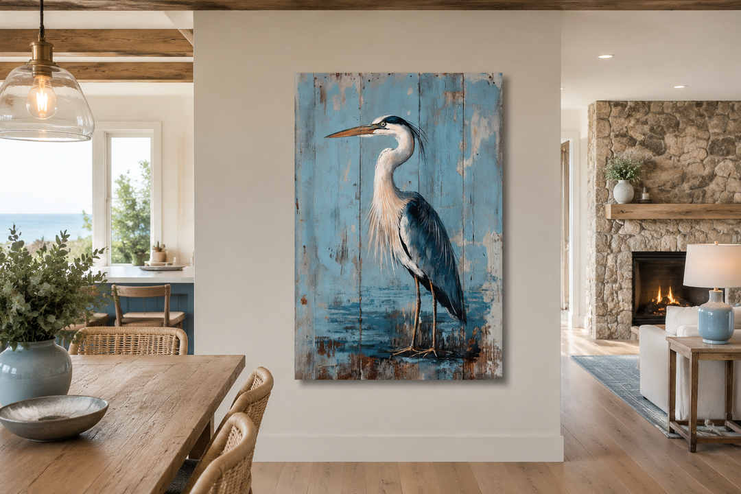 Rustic blue heron painting on weathered wood-textured canvas in a coastal dining room.