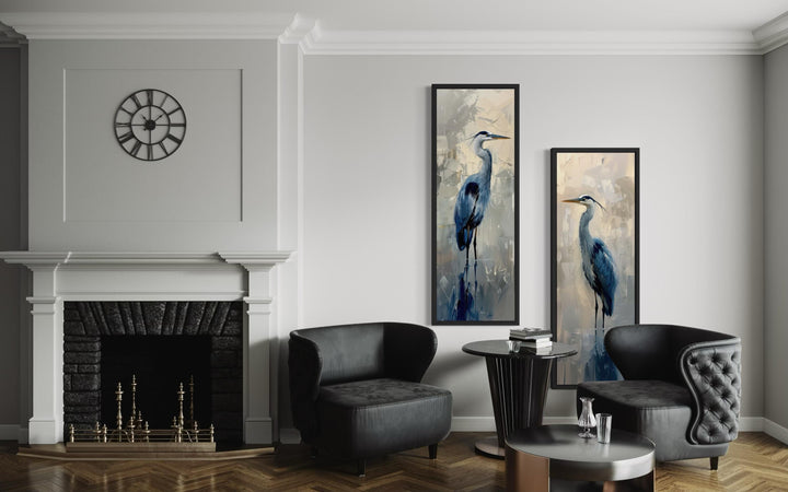 Set of two tall narrow canvas wall art prints featuring blue herons in a modern painterly style.