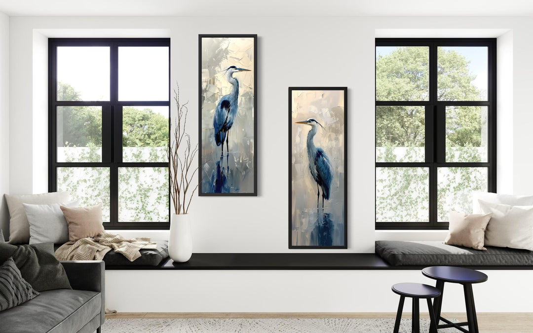 A set of two tall, narrow canvas prints featuring blue herons in a modern, painterly style.