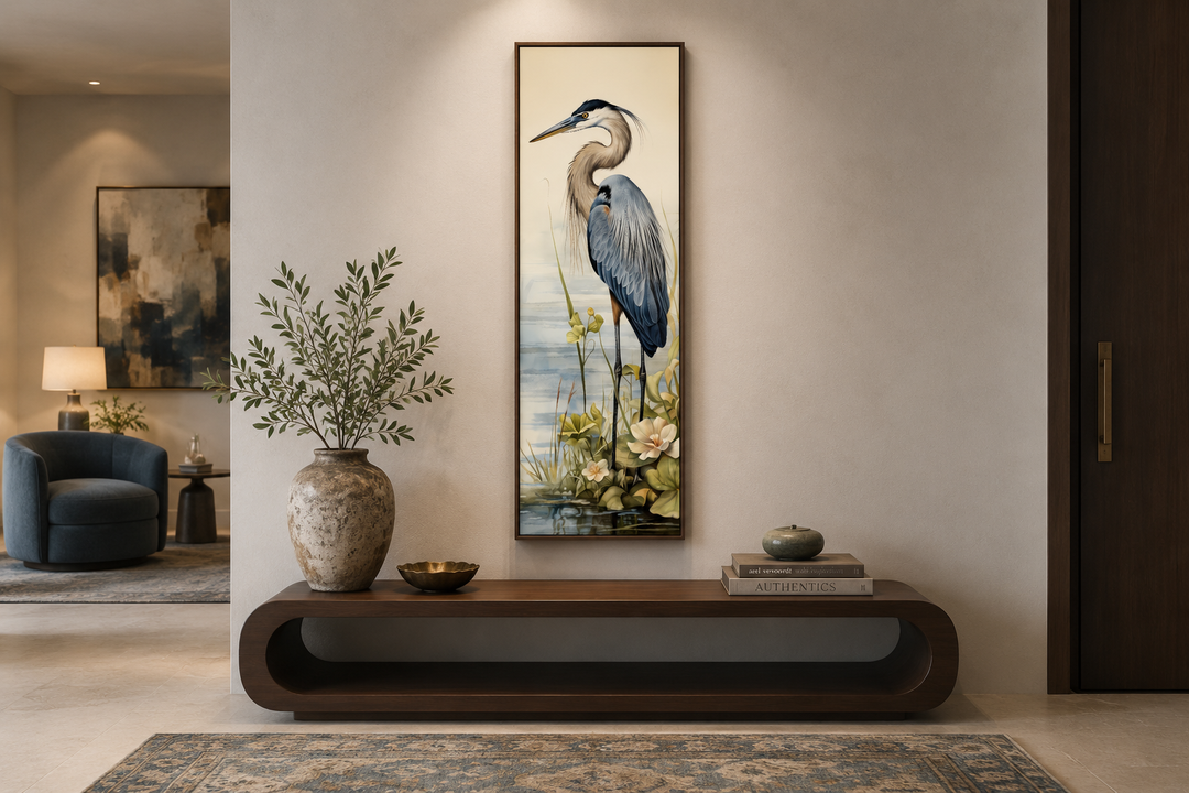 Tall narrow vertical framed canvas wall art featuring a detailed blue heron in a coastal setting.