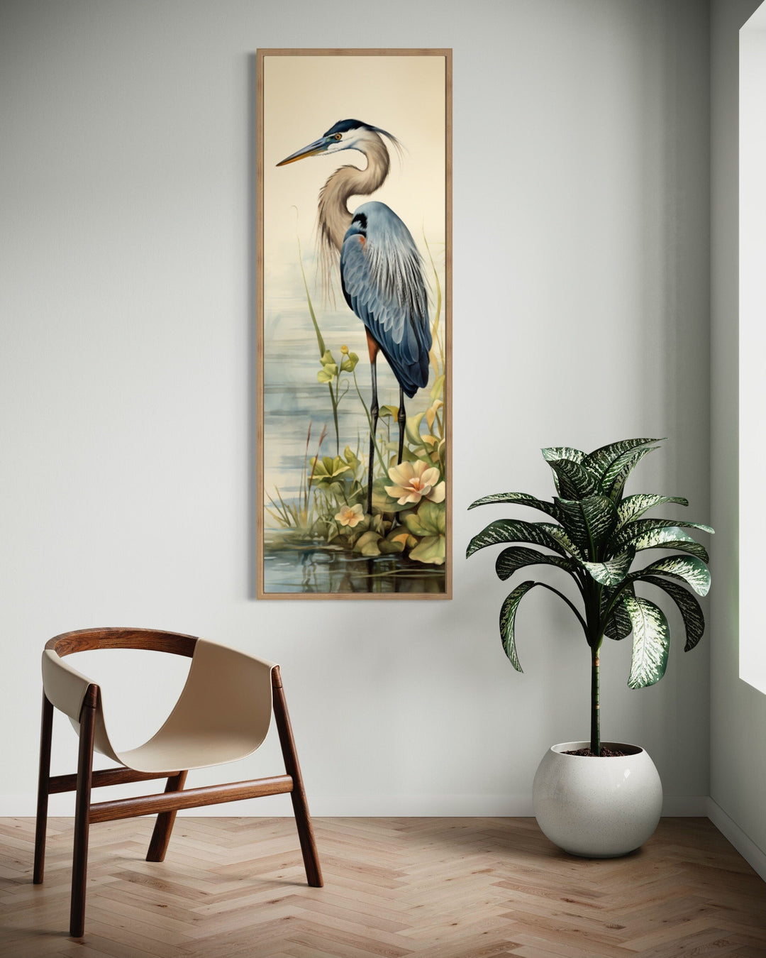 Tall narrow vertical framed canvas wall art featuring a blue heron in a coastal landscape.
