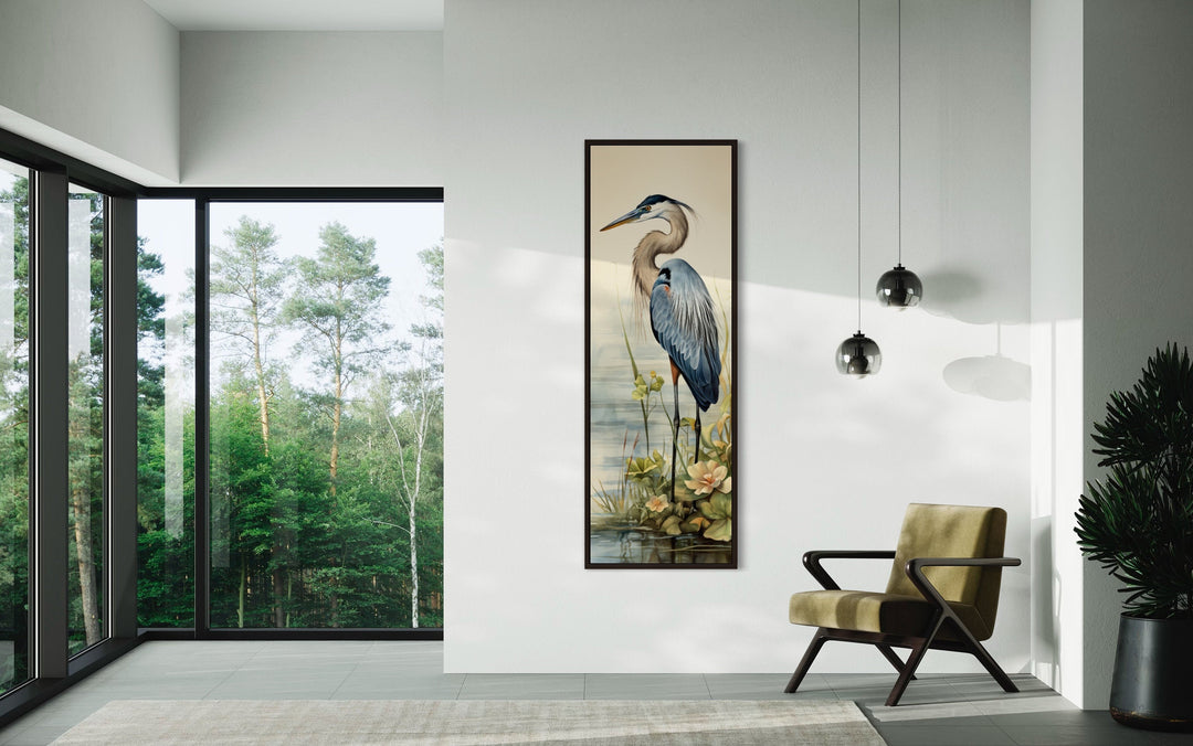 Blue Heron tall narrow vertical framed canvas wall art hanging in a modern minimalist living room.