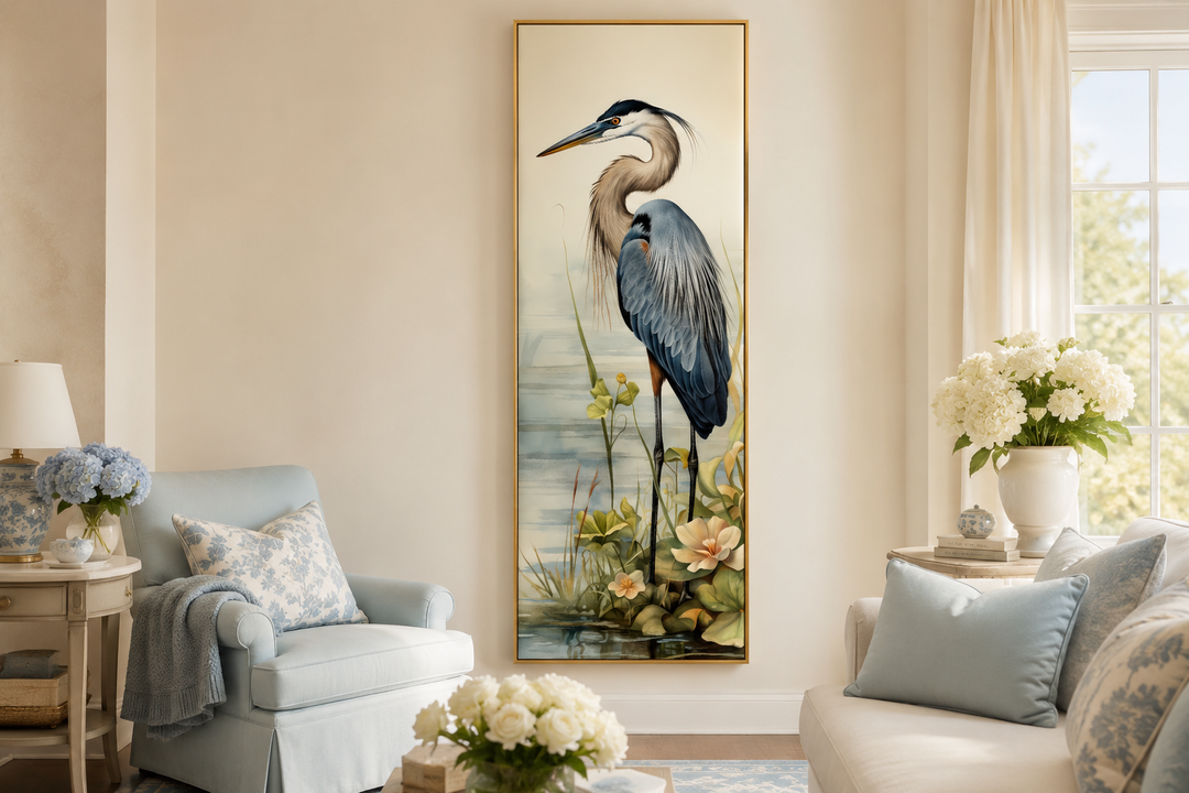 Tall narrow vertical framed canvas wall art featuring a detailed blue heron in a coastal setting.