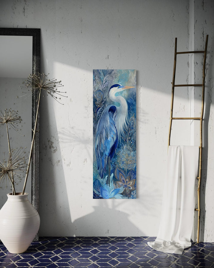 Tall narrow canvas print of a blue heron with intricate patterns in a serene, modern room setting.