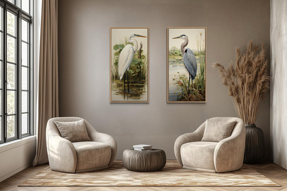 Two framed canvas prints featuring a blue heron and a white egret in a lush wetland setting.