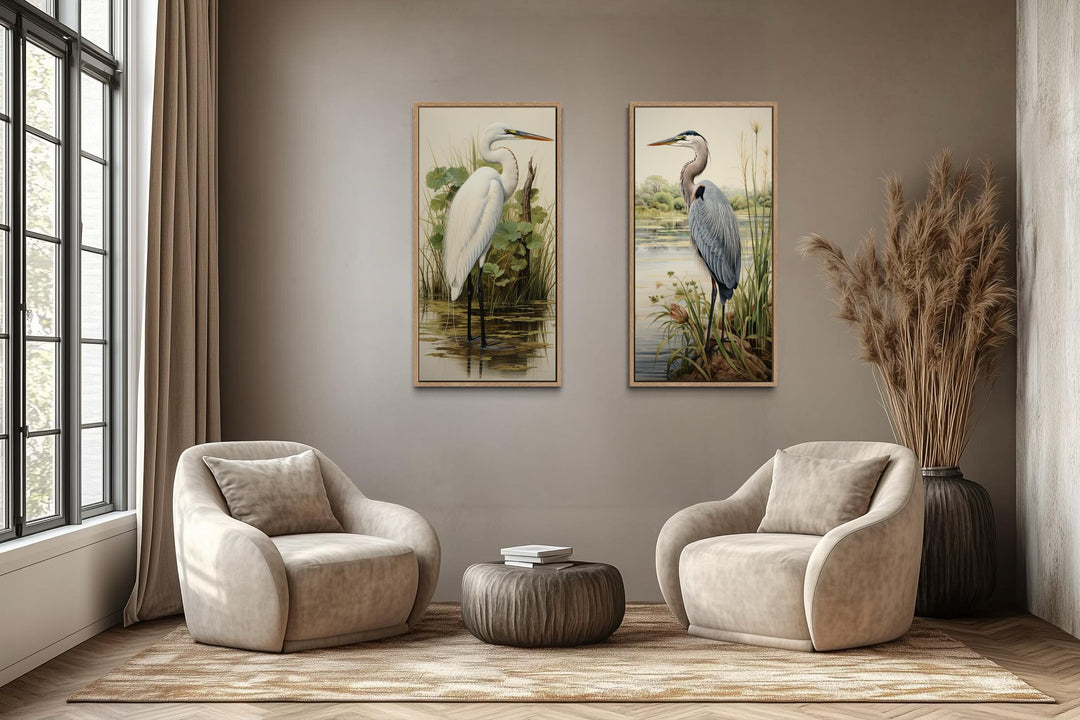 Two framed canvas prints featuring a blue heron and a white egret in a lush wetland setting.