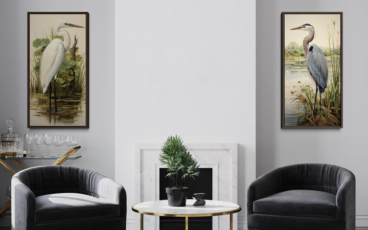 Set of two framed canvas prints featuring a blue heron and a white egret in a marshland setting.
