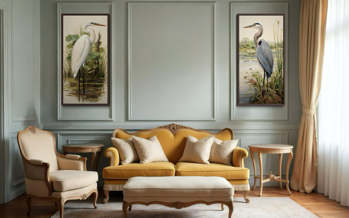 Set of two canvas wall art pieces featuring a blue heron and an egret in a classic interior.