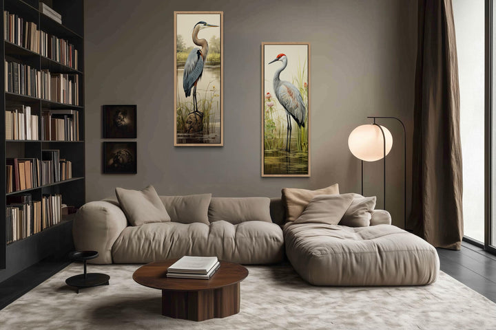 Set of two tall vertical canvas wall art pieces featuring a blue heron and a sandhill crane.