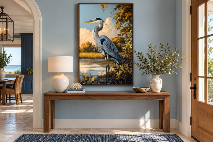 Great Blue Heron in Marshland framed canvas wall art hanging above a wooden console table.