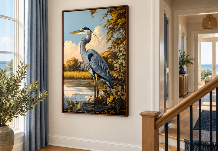 Great Blue Heron in marshland framed canvas wall art displayed on a wall near a staircase.