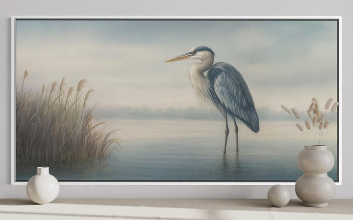 Blue Heron in Misty Lake framed canvas wall art with reeds and a soft blue and gray color palette.
