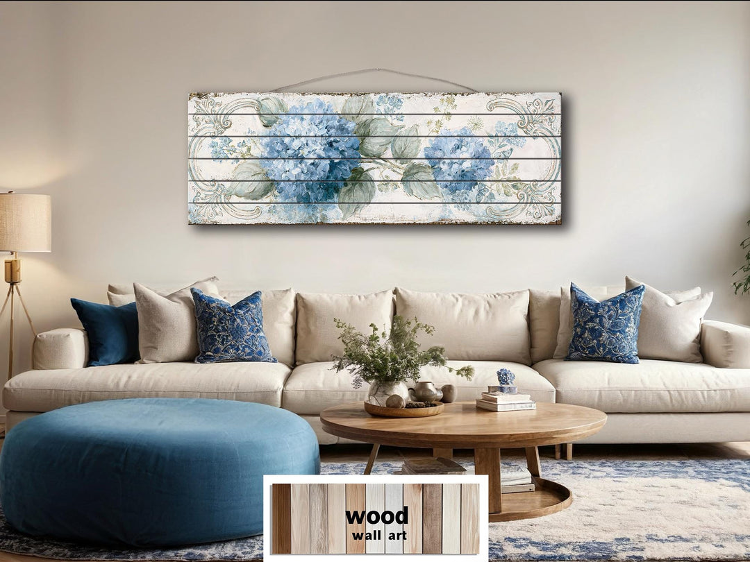 Blue hydrangea floral design printed on horizontal distressed wood planks above a living room sofa.
