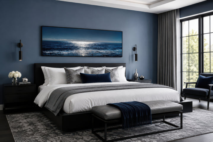 Blue Silver Ocean Horizon Long Horizontal Seascape Wall Art above a bed in a modern bedroom.