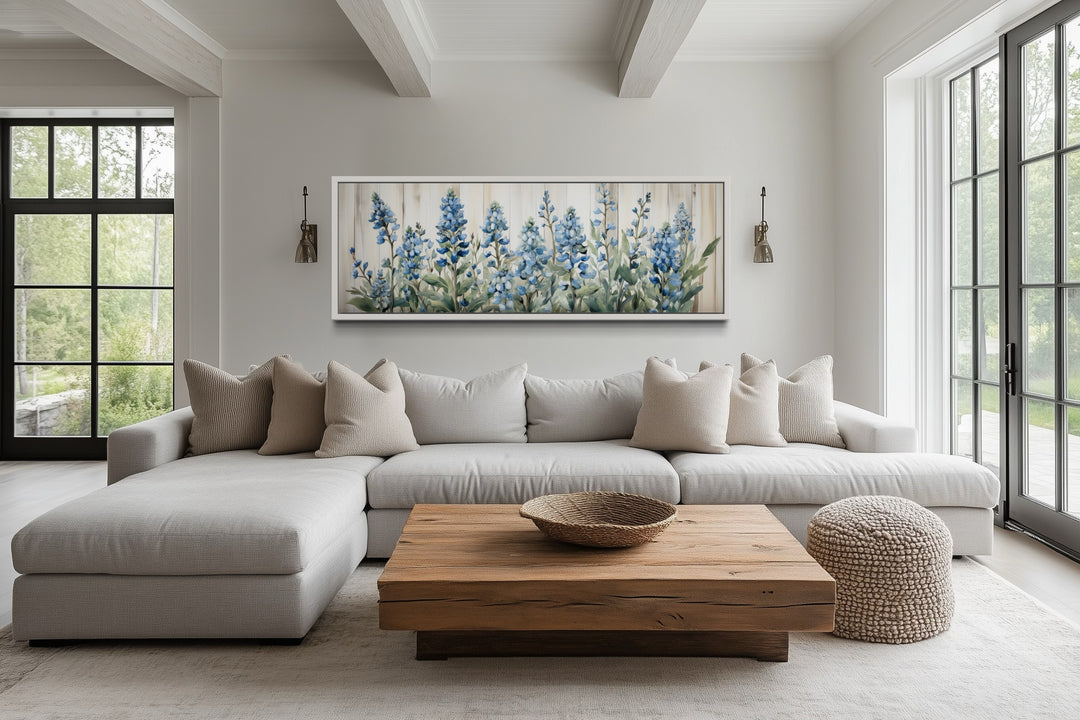 Blue wildflowers horizontal framed canvas wall art displayed above a neutral sectional sofa.