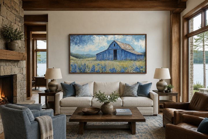 Blue Barn and Bluebonnets rustic framed canvas wall decor above a sofa in a farmhouse living room.