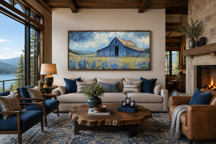 Rustic framed canvas wall decor featuring a blue barn and bluebonnets in a farmhouse living room.