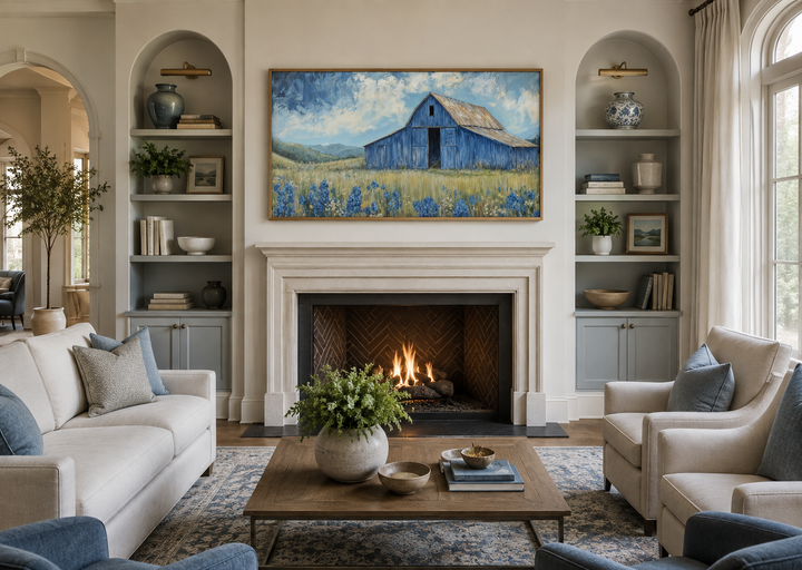 Blue Barn and Bluebonnets rustic framed canvas wall decor above a fireplace in a living room.
