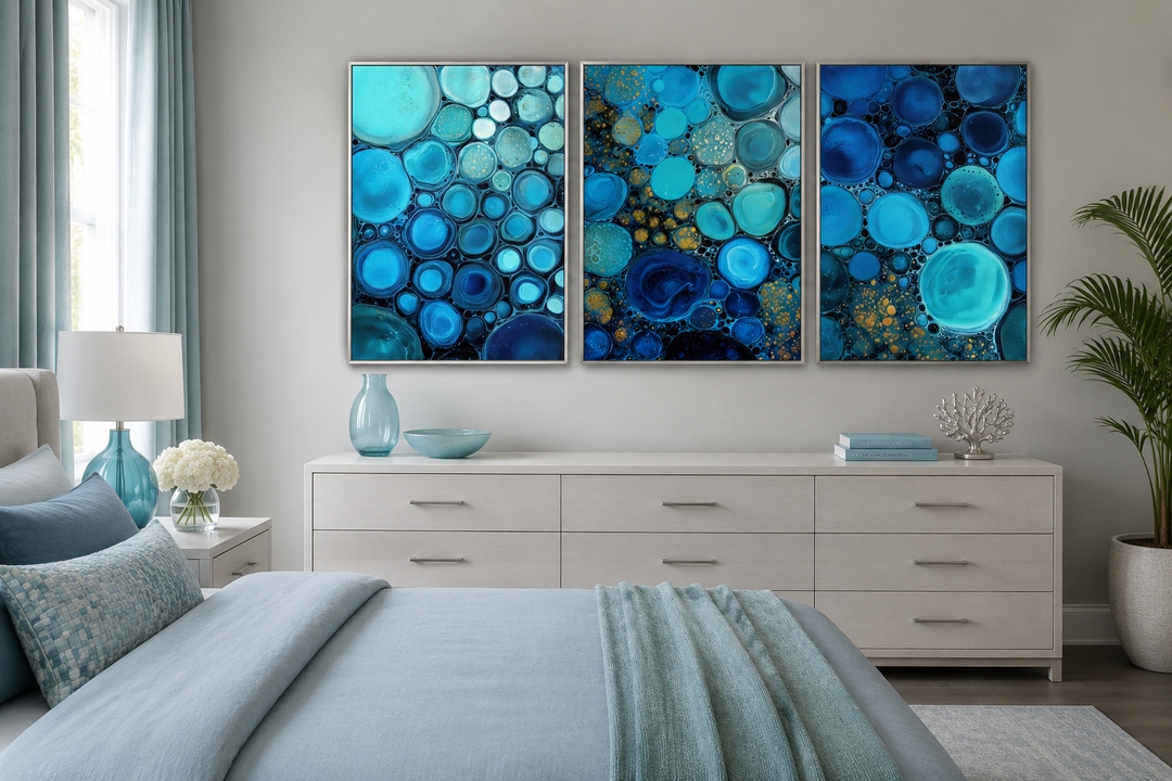 Three-piece abstract canvas set featuring blue, aqua, and navy bubble patterns above a dresser.