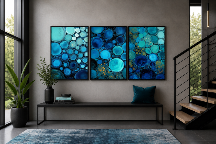 Set of 3 abstract canvas prints featuring blue, aqua, and navy bubbles for coastal wall decor.