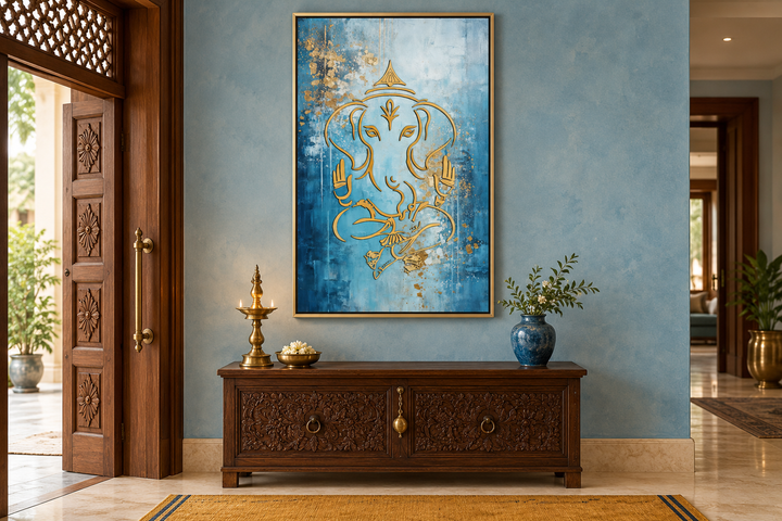 Modern blue and gold Lord Ganesha canvas wall art in a gold frame above a carved wooden console.