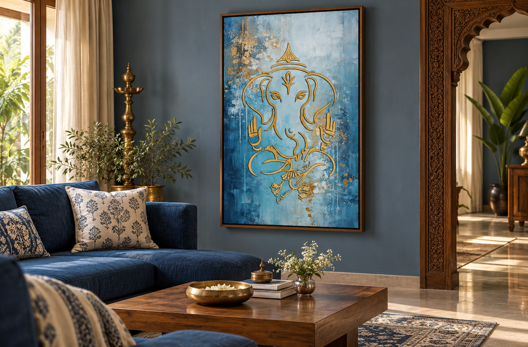 Modern blue and gold Lord Ganesha canvas wall art in a walnut frame above a blue sofa.