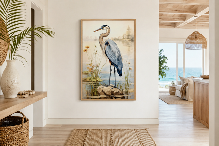 Framed vintage canvas wall art of a blue heron standing in reeds, displayed in a coastal hallway.