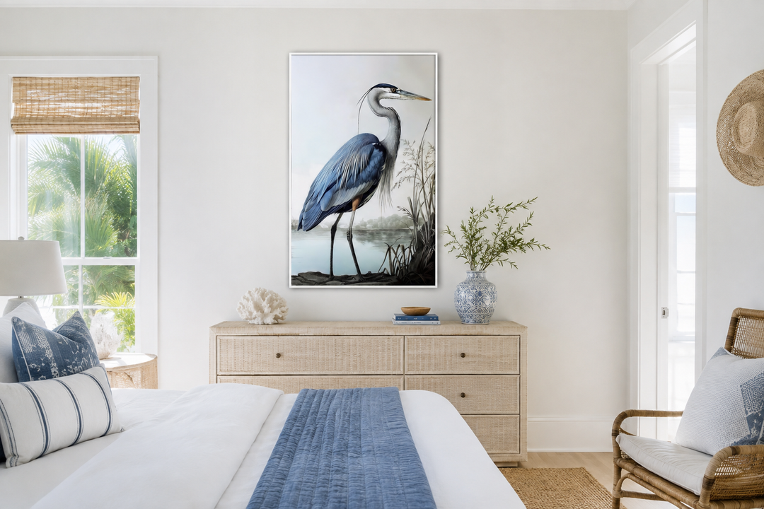 Blue Heron Painting Coastal Framed Canvas Wall Art hanging above a dresser in a coastal bedroom.