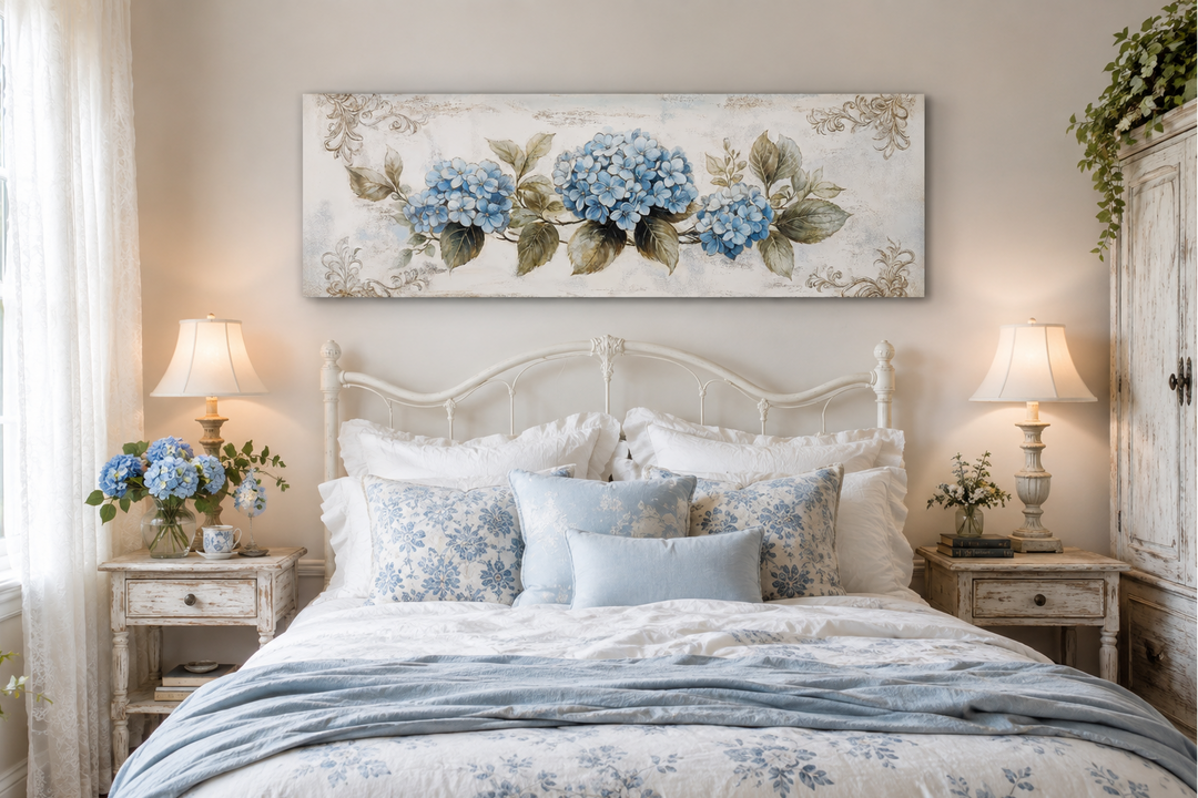 Shabby chic blue hydrangea long horizontal canvas wall art above a white bed in a romantic bedroom.