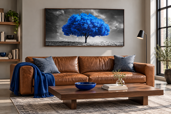 Blue Tree on Black White Background Framed Canvas Wall Art above a brown leather sofa.