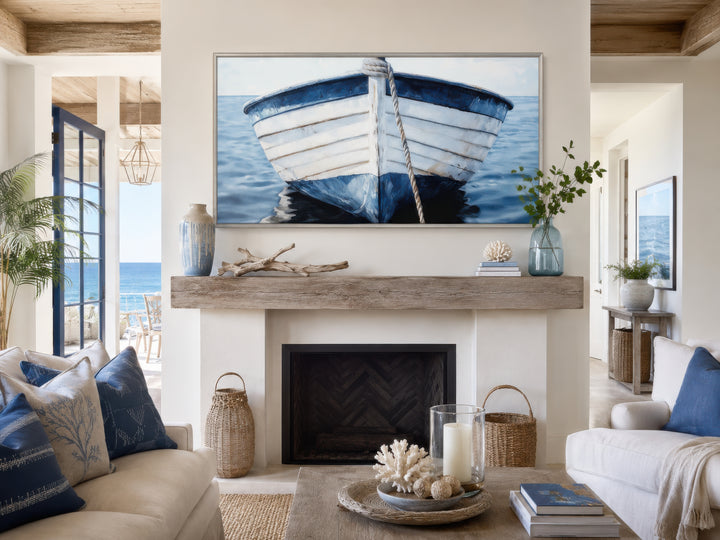 Rustic blue and white boat canvas wall art above a fireplace in a coastal living room.