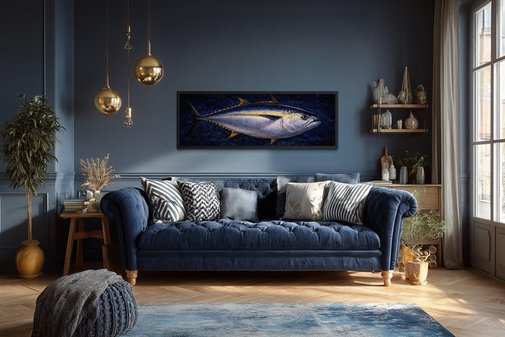 Long horizontal canvas painting of a bluefin tuna swimming in deep navy water on a dark blue wall.